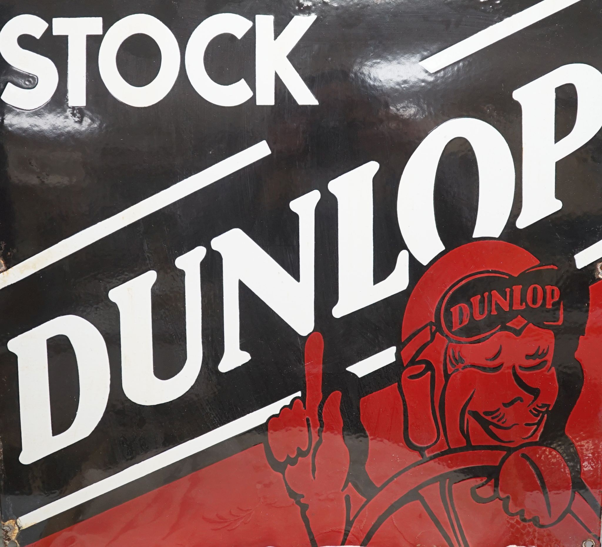 A Dunlop stock enamelled sign 43cm sq